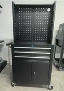 Rolling tool cabinet with raised perforated pegboard and lower door storage
