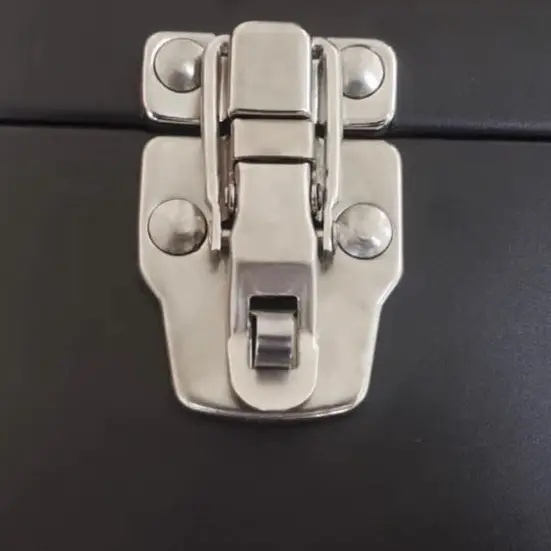 Front latch detail on the compact black steel toolbox
